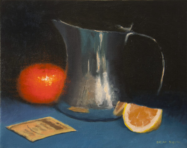 Steel jug and mandarin