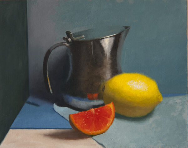 Lemon, jug, and orange slice